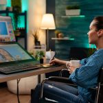 Photo editing software expert retouching work at desk